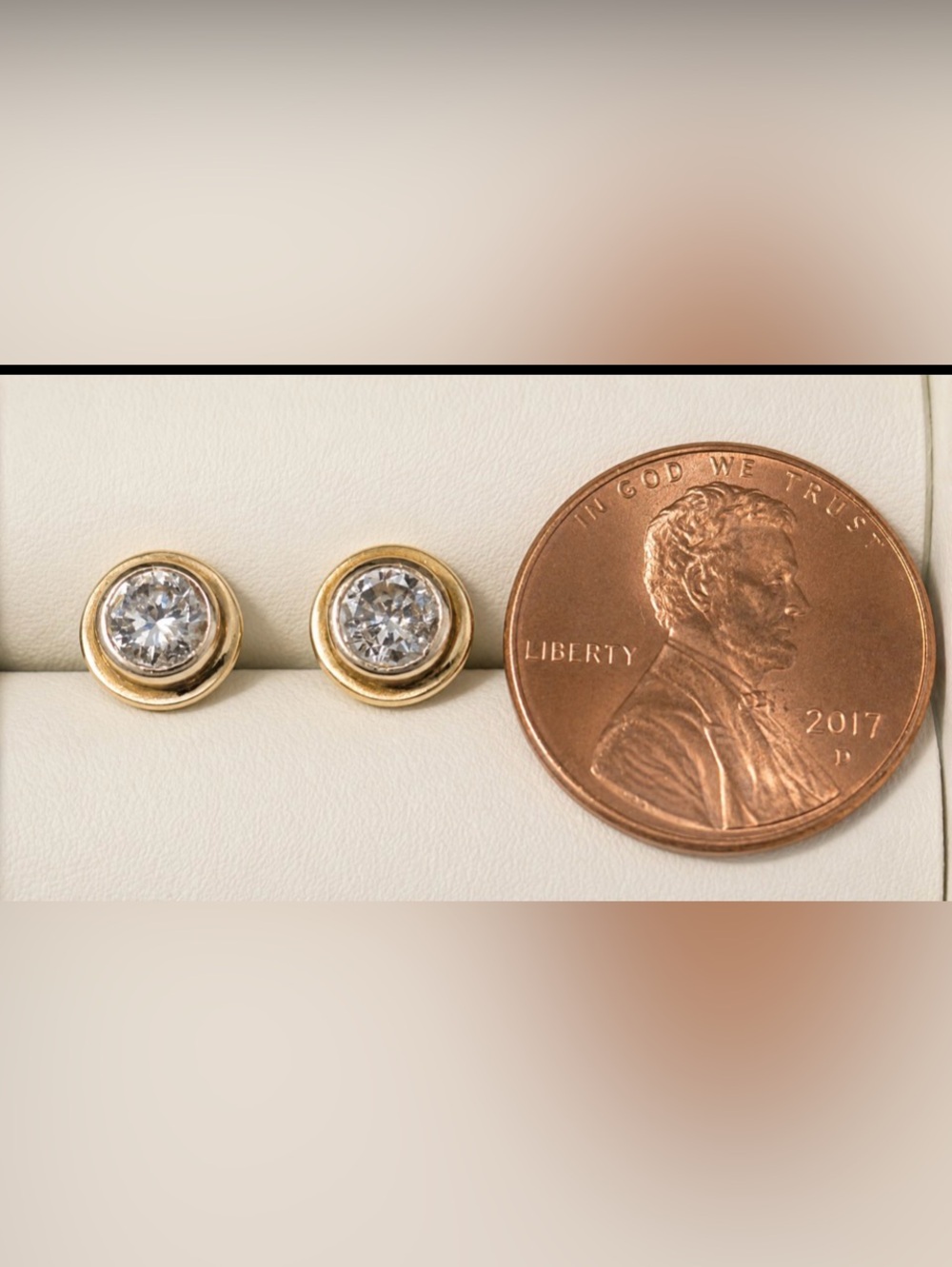 14k gold bezel set diamond earrings. .50 TCW.